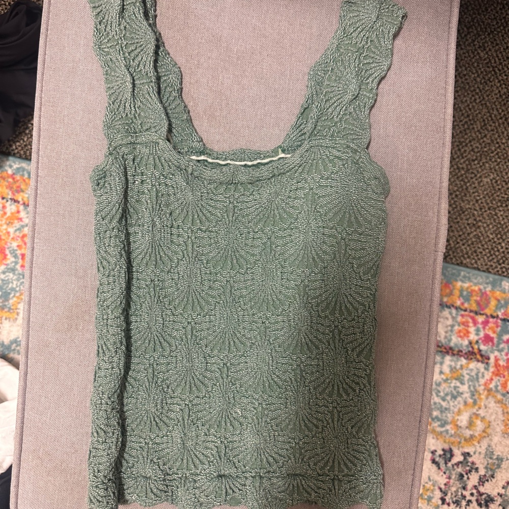 Free people teal tank top. Stretchy. Size M/L.